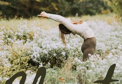 Ashley in a standing backbend among the wildflowers