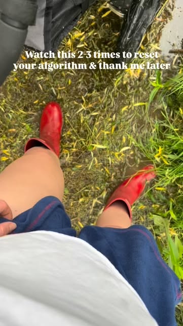 Red boots walking through long grass